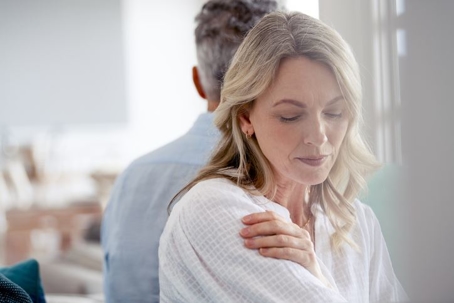 Couple fighting at home sitting on the sofa