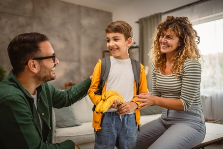 parents helping child get ready for school