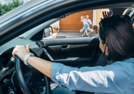 mom dropping child off with dad