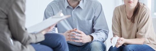 Conflicted husband and wife during divorce mediation